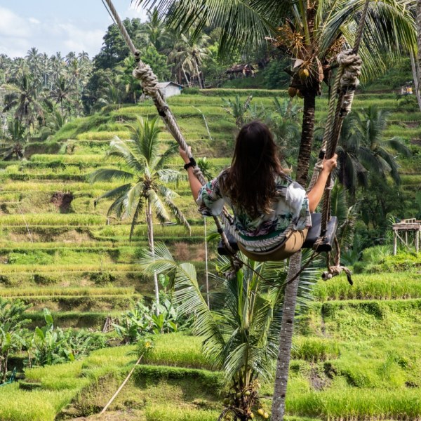 girl on swing in Bali photo